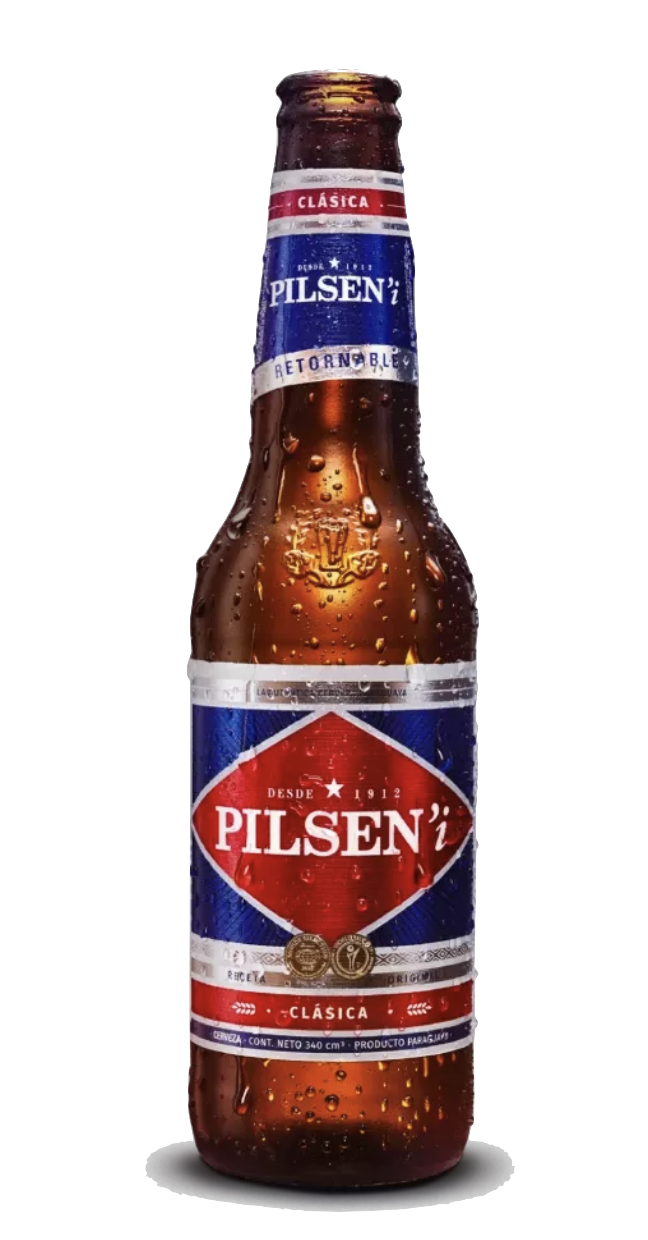 Pilsen Clásica beer in an amber glass bottle